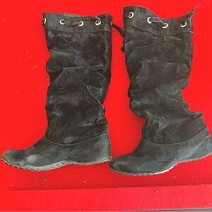 Black knee high boots.